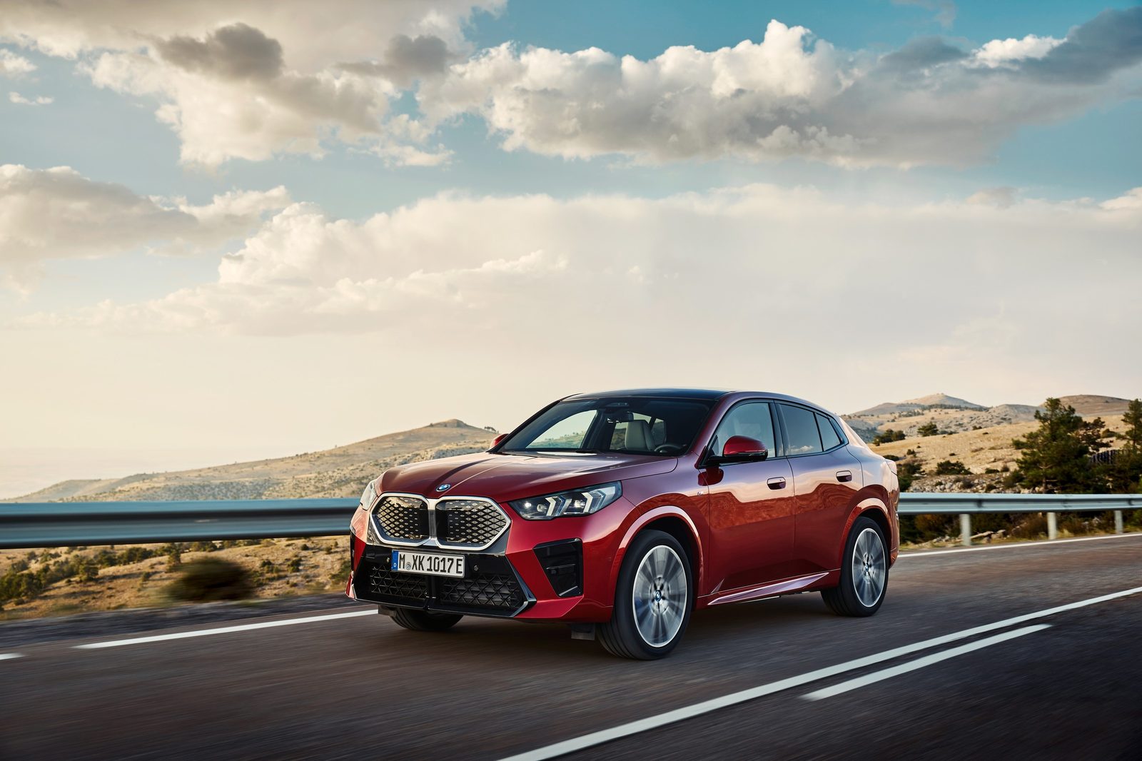 BMW iX2 Global 2024 - main model photo, exterior, front 3q driving, Global reference market