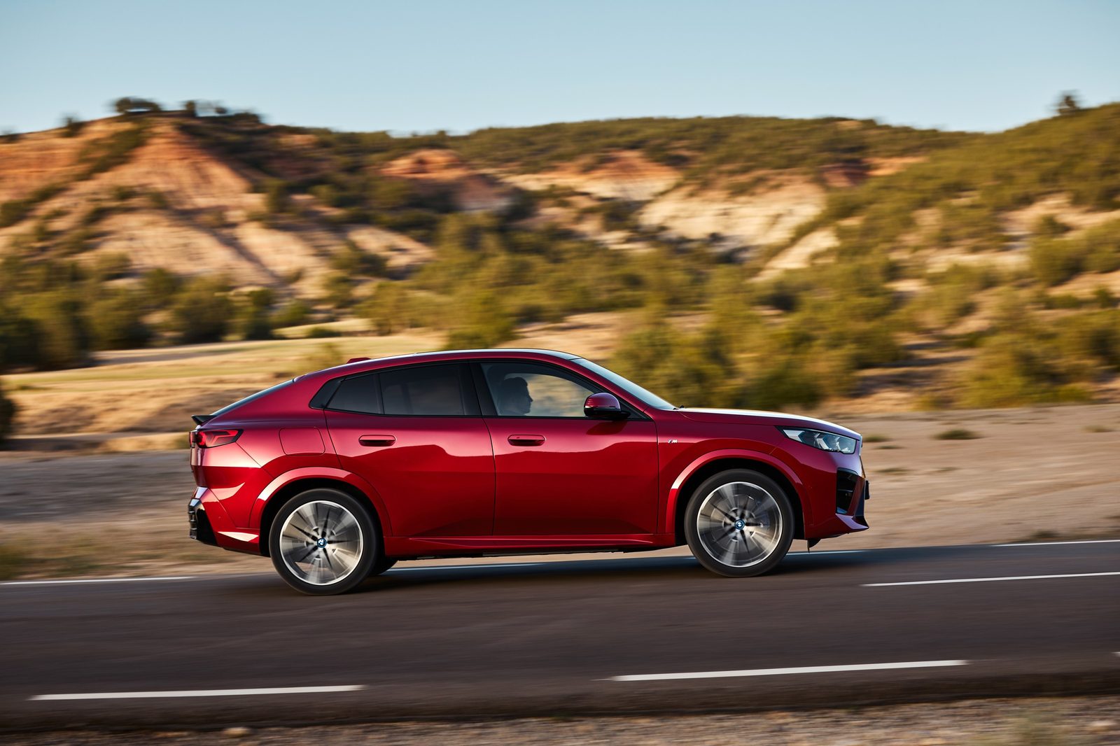 BMW iX2 Global 2024 - exterior, side driving, Global reference market