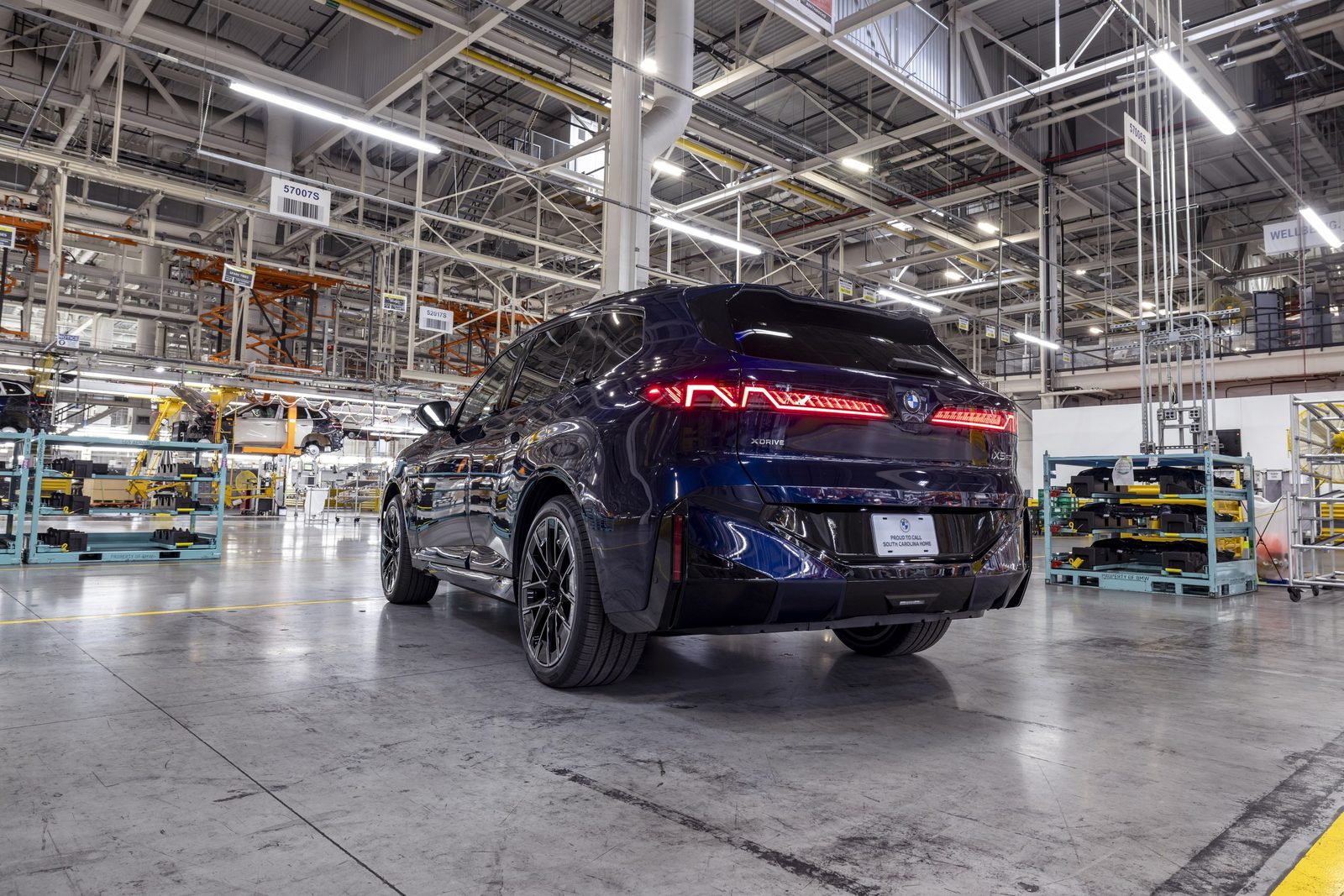 BMW iX5 Global 2027 - exterior, rear 3q factory, global announcement market