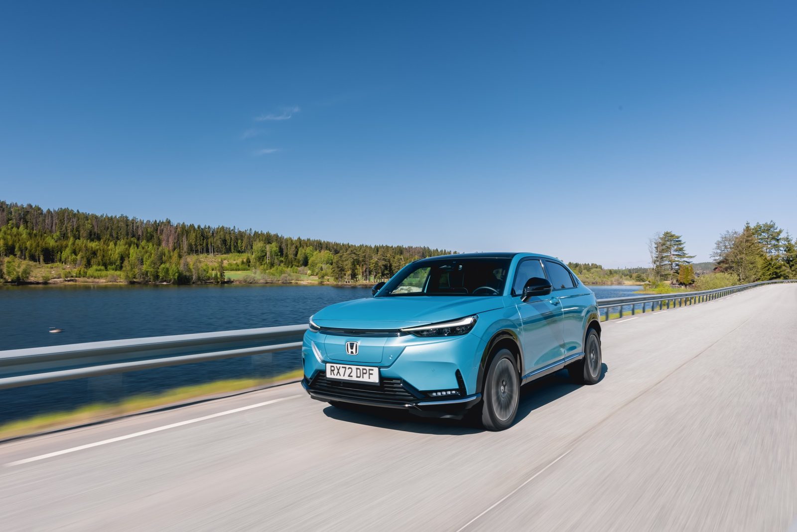 Honda e:Ny1 Global 2023 - main model photo, exterior, front 3q driving, Europe/global reference market