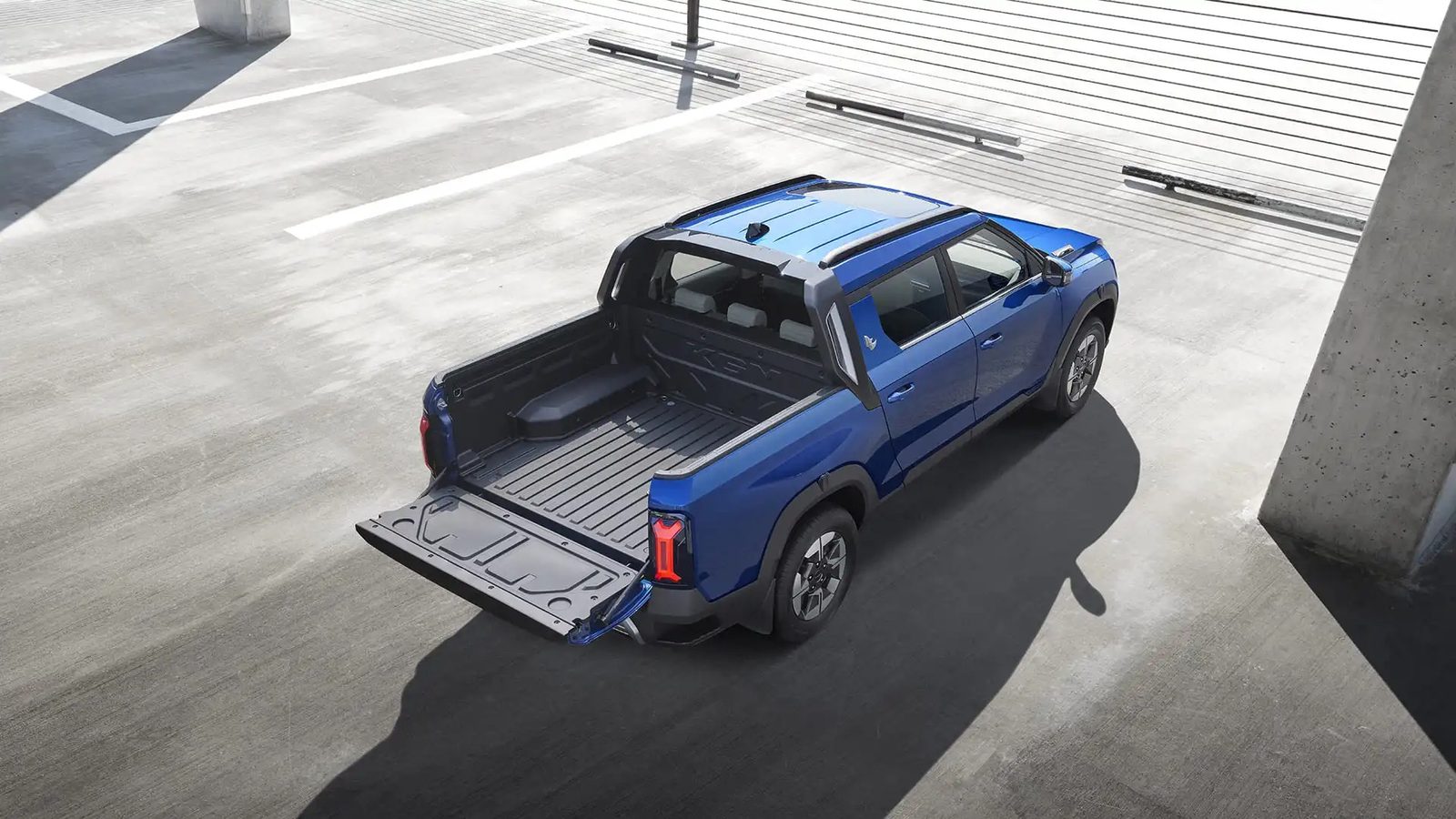 KGM Musso EV 2025 - exterior, rear top 3q, eu_reference market