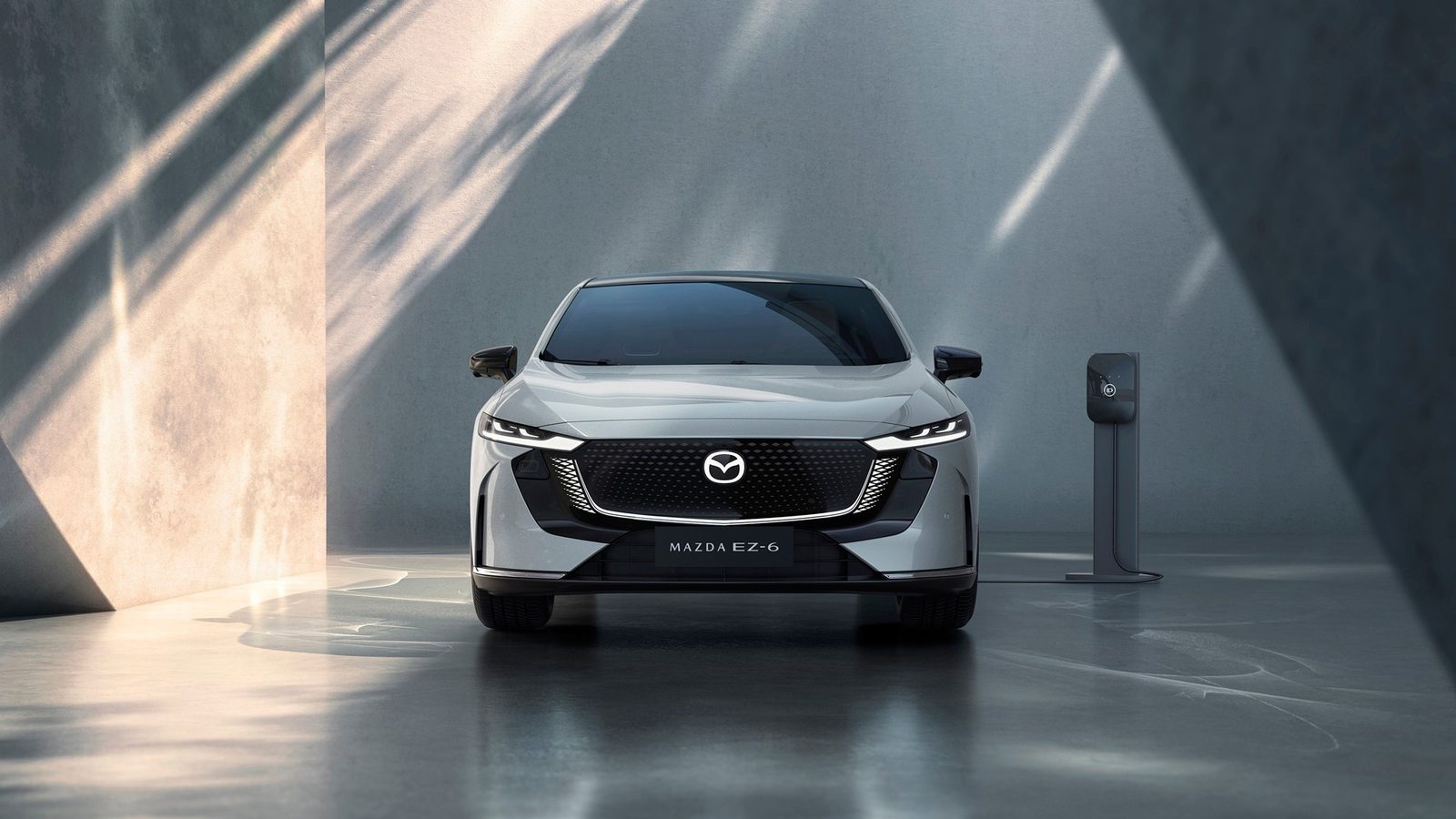 Mazda6e Global 2025 - main model photo, exterior, front charging, Global/Europe reference via Mazda6e/EZ-6 donor market
