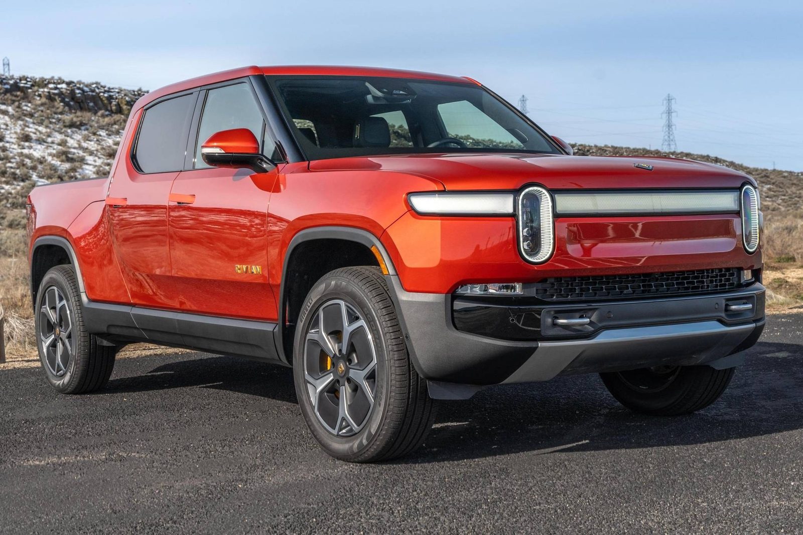 Rivian R1T (2027) - exterior, front three-quarter view, USA market