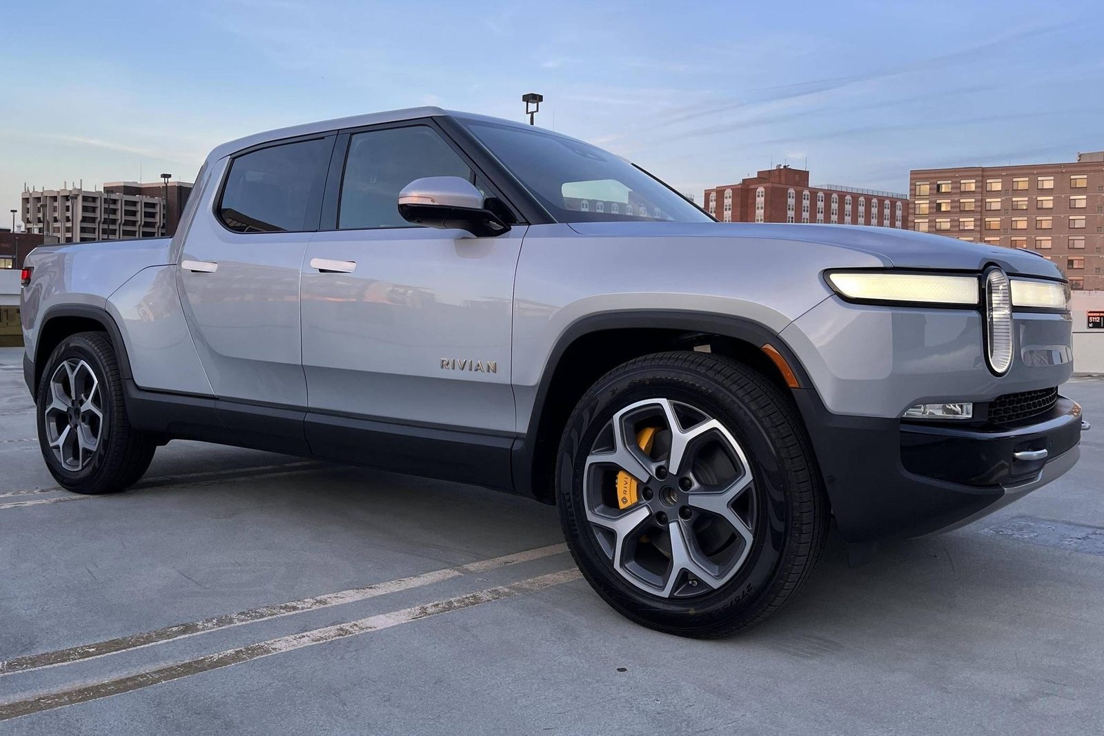 Rivian R1T (2027) - exterior, front three-quarter view, USA market