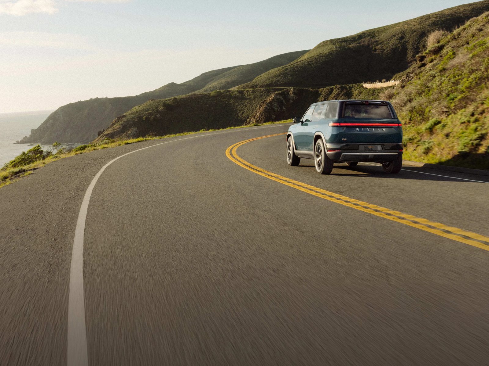 Rivian R2 2026 - exterior, rear driving, US market