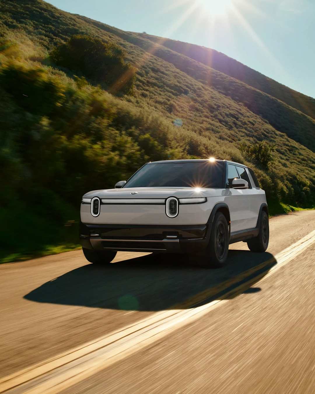 Rivian R2 2026 - exterior, front 3q driving, US market