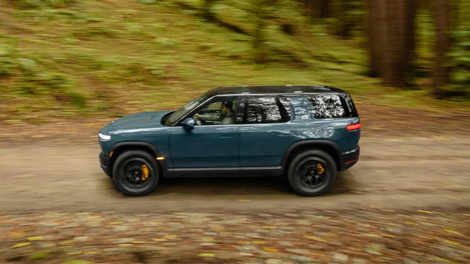 Rivian R2 2026 - exterior, side driving, US market