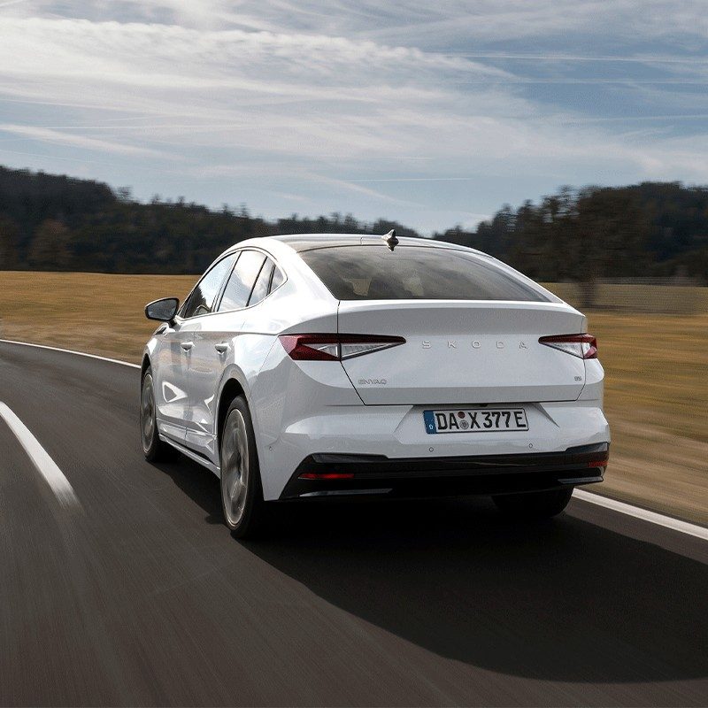Škoda Enyaq Coupé 2022 - exterior, rear 3q driving, Europe / EV Query only market