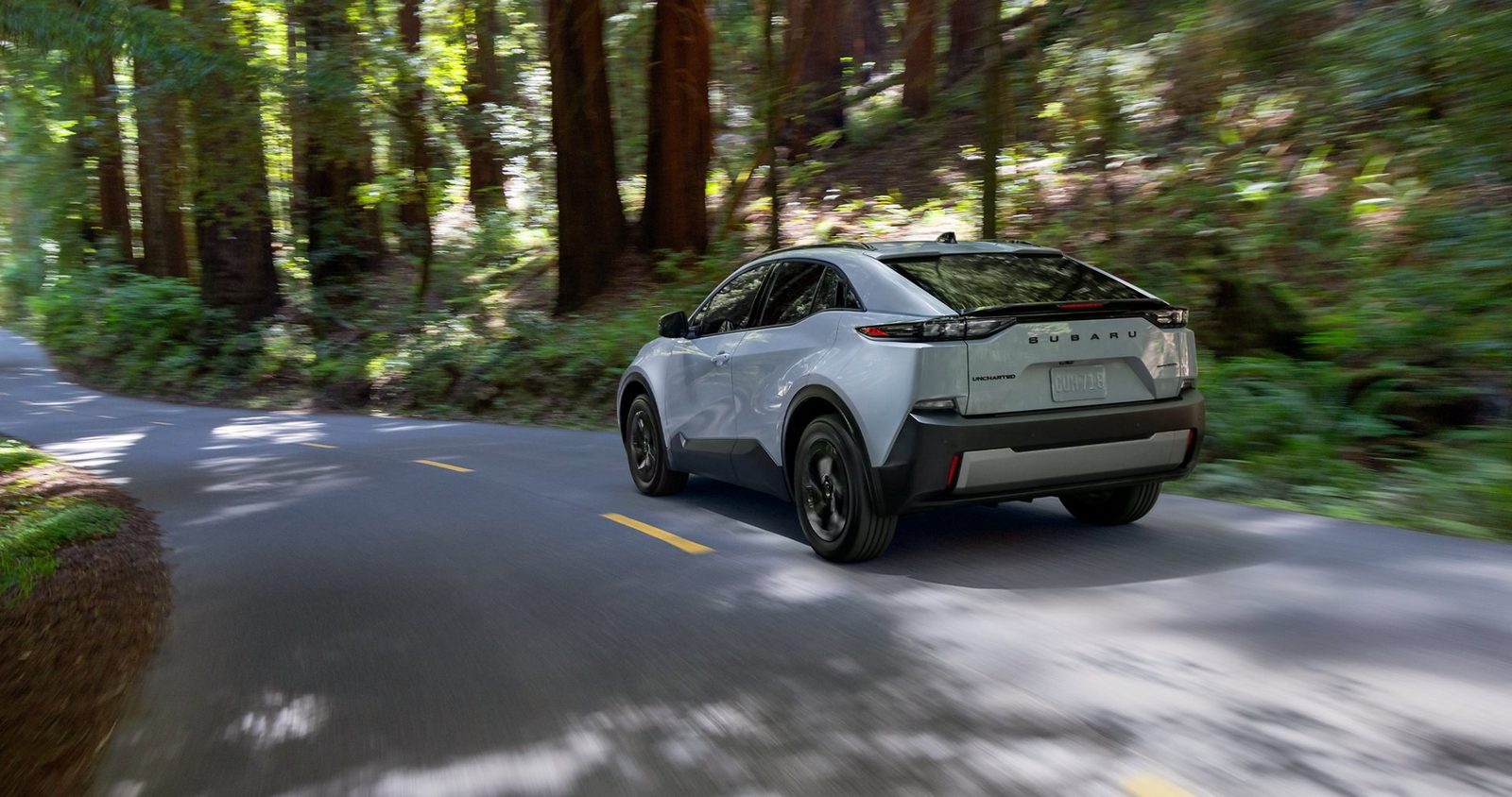 Subaru Uncharted EV 2026 - exterior, rear 3q driving, US / EV Query only market